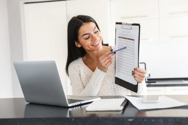 A professional woman in a virtual meeting explaining her brand's vision and requirements for graphic design services.