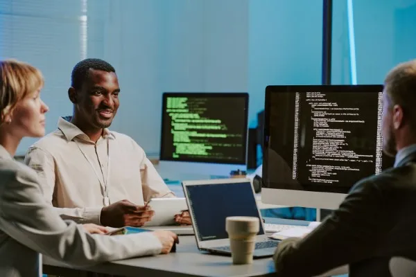 IT and software developers collaborating on innovative solutions, leveraging nearshore software development expertise.